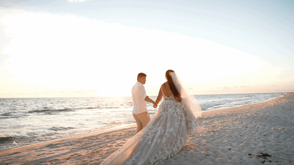 Couple walking on the beach during sunset on the Gulf Coast